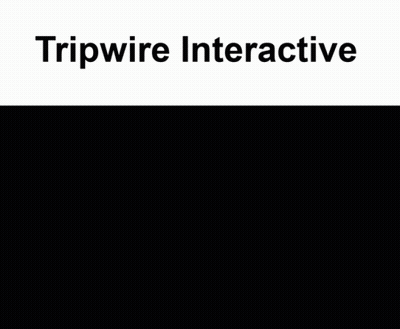 a man in a suit and tie shakes hands with another man in a hallway with tripwire interactive written on the top