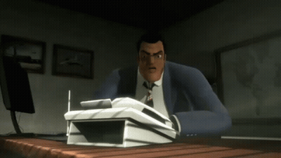 A Man In A Suit And Tie Sits At A Desk With A Stack Of Papers On It GIF