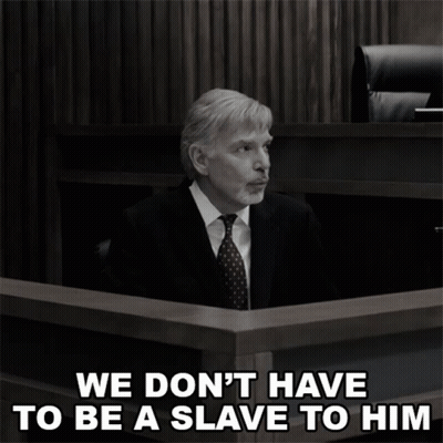 A Man In A Suit And Tie Sits In A Courtroom With The Words " We Don 'T Have To Be A Slave To Him " GIF