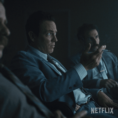 A Man In A Suit And Tie Sits In A Dark Room With The Words " It 'S A Fair Point " On The Bottom GIF