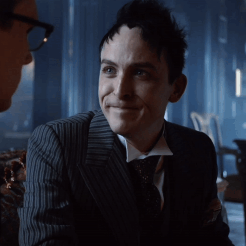 A Man In A Suit And Tie Smiles With The Words I 'Ll Always Be Below Him GIF