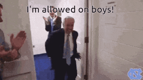 A Man In A Suit And Tie Standing In A Doorway With The Words I 'M Allowed On Boys Below Him GIF