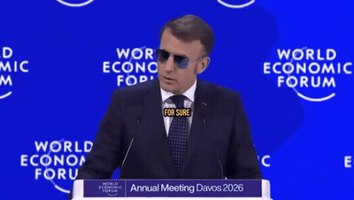 A Man In A Suit And Tie Stands At A Podium At The World Economic Forum GIF