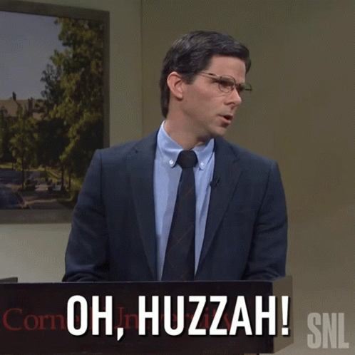 A Man In A Suit And Tie Stands Behind A Podium That Says Oh Huzzah Snl GIF