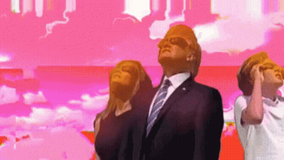 A Man In A Suit And Tie Stands In Front Of A Pink Background GIF