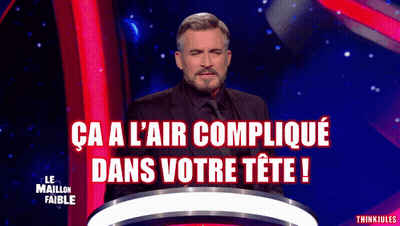 A Man In A Suit And Tie Stands In Front Of A Podium With The Words Ca A L' Air Complique Dans Votre Tete GIF