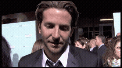 A Man In A Suit And Tie Stands In Front Of A Sign That Says ' A Few Good Men ' On It GIF
