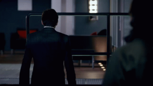 A Man In A Suit And Tie Stands In Front Of A Sign That Says Do N't Push Your Luck GIF