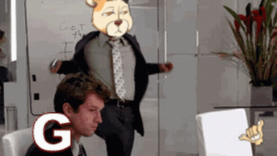 A Man In A Suit And Tie Stands In Front Of A White Board That Says Get The I On It GIF
