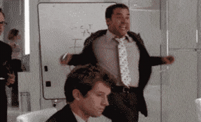 A Man In A Suit And Tie Stands In Front Of A White Board That Says " S = C = T " On It GIF