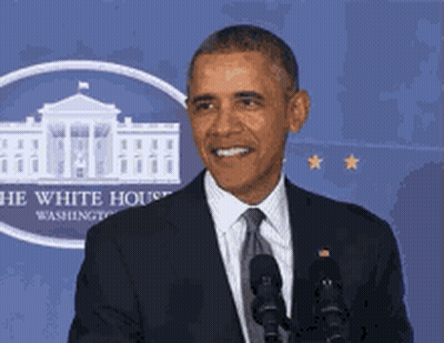 A Man In A Suit And Tie Stands In Front Of Microphones In Front Of The White House GIF
