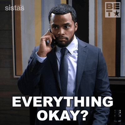 A Man In A Suit And Tie Talking On A Cell Phone With The Words Everything Okay Behind Him GIF