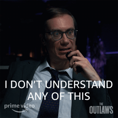 A Man In A Suit And Tie Talking On A Phone With The Words " I Don 'T Understand Any Of This " Behind Him GIF