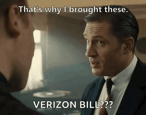 A Man In A Suit And Tie Talking To Another Man With The Caption That 'S Why I Brought These Verizon Bill?? GIF