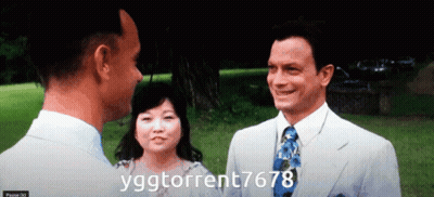 A Man In A Suit And Tie Talks To A Woman And Another Man In A White Suit GIF