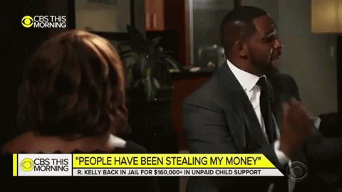 A Man In A Suit And Tie Talks To A Woman On Cbs This Morning GIF