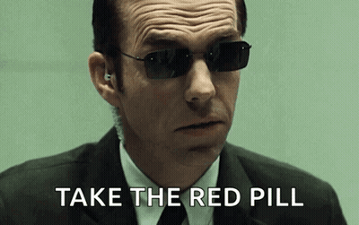 A Man In A Suit And Tie Wearing Sunglasses Says Take The Red Pill GIF