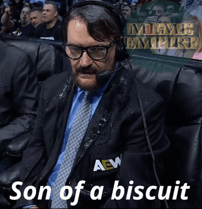 A Man In A Suit And Tie With A Aew Logo On His Jacket GIF