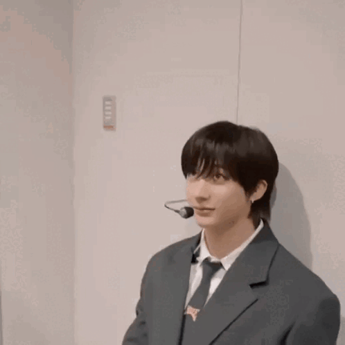 Man In Suit And Tie With Microphone GIF
