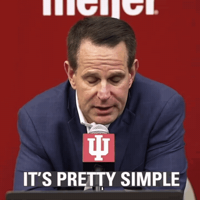 A Man In A Suit And Tie With A Microphone That Says It 'S Pretty Simple GIF