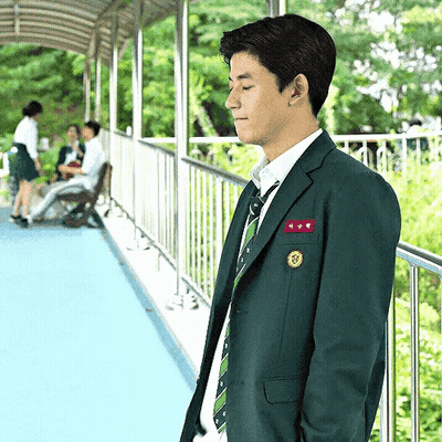 A Man In A Suit And Tie With A Name Tag That Says ' A ' GIF