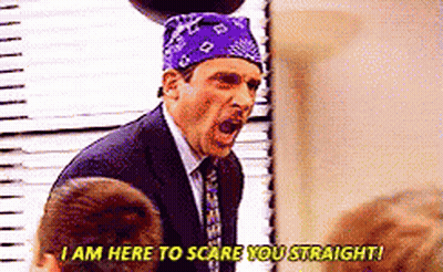 A Man In A Suit And Tie With A Purple Bandana On His Head Is Screaming At Someone . GIF