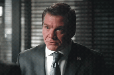 A Man In A Suit And Tie With A White Shirt GIF