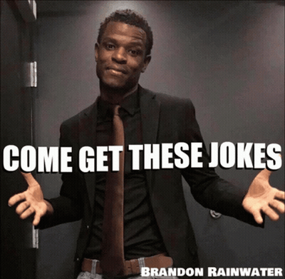 A Man In A Suit And Tie With Come Get These Jokes Brandon Rainwater GIF
