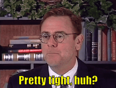 A Man In A Suit And Tie With Glasses Says Pretty Tight Huh GIF