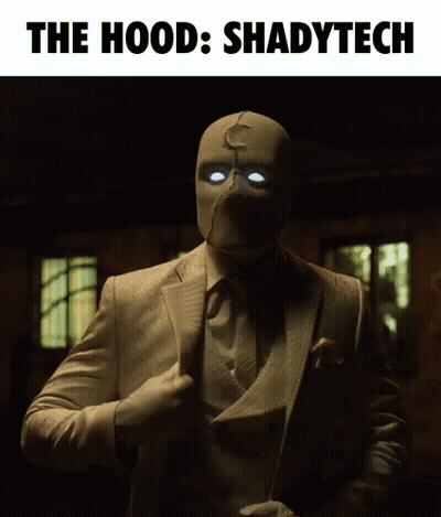 A Man In A Suit And Tie With Glowing Eyes And The Words The Hood Shadytech Above Him GIF