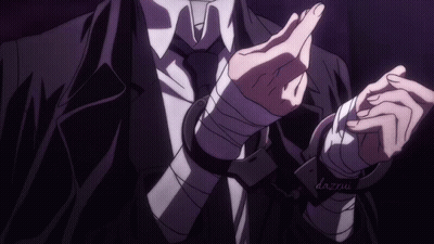 A Man In A Suit And Tie With Handcuffs On His Wrists And The Name Dazxu On The Bottom GIF