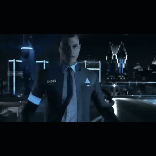 A Man In A Suit And Tie With Rx800 On His Chest GIF