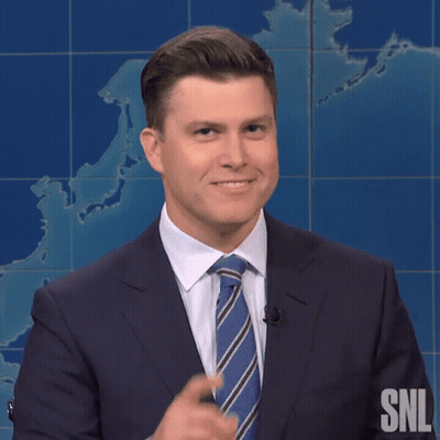 A Man In A Suit And Tie With Snl Written On The Bottom GIF