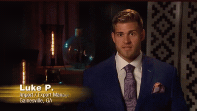 A Man In A Suit And Tie With The Name Luke P. GIF