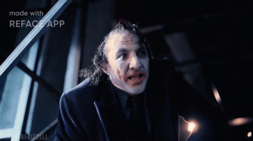 A Man In A Suit And Tie With The Word And On The Bottom GIF