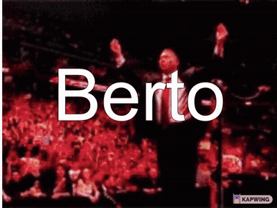 A Man In A Suit And Tie With The Word Berto Written On His Face GIF