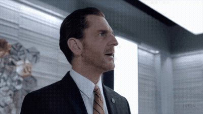 A Man In A Suit And Tie With The Word Meta On The Bottom Left GIF