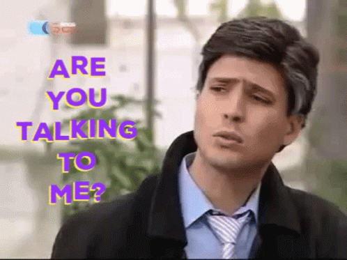 A Man In A Suit And Tie With The Words Are You Talking To Me GIF