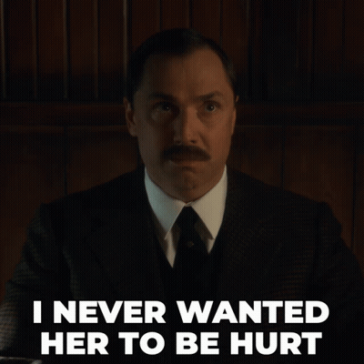 A Man In A Suit And Tie With The Words I Never Wanted Her To Be Hurt Below Him GIF
