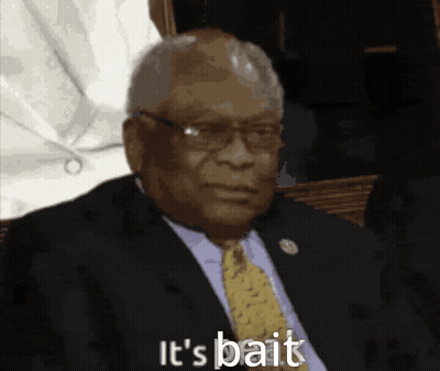 A Man In A Suit And Tie With The Words It 'S Bait Below Him GIF