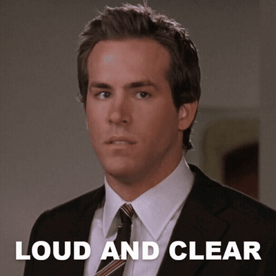 A Man In A Suit And Tie With The Words " Loud And Clear " Below Him GIF