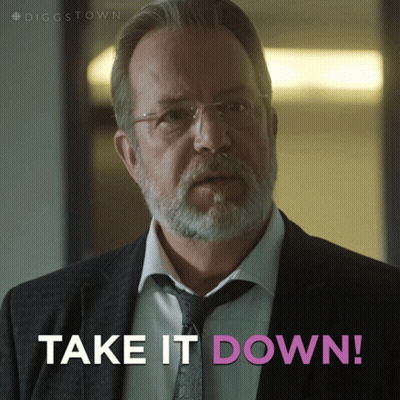 A Man In A Suit And Tie With The Words Take It Down Below Him GIF
