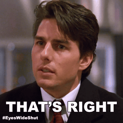 A Man In A Suit And Tie With The Words That 'S Right Below Him GIF
