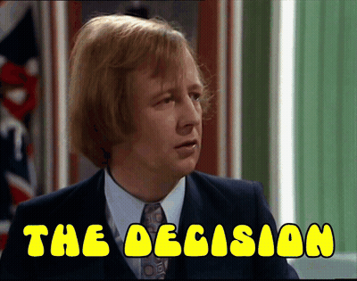 A Man In A Suit And Tie With The Words " The Decision " Below Him GIF