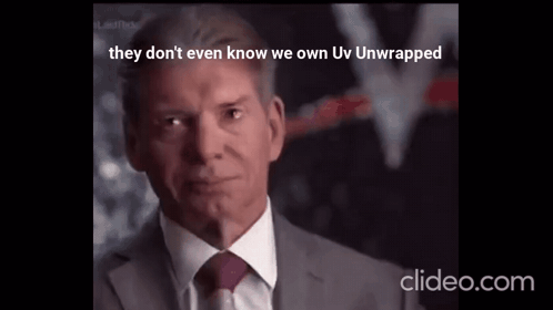 A Man In A Suit And Tie With The Words They Don 'T Even Know We Own Uv Unwrapped Below Him GIF