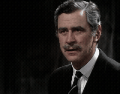 A Man In A Suit And Tie With The Words " They 'Re Not Half The Men They Were " Above Him GIF