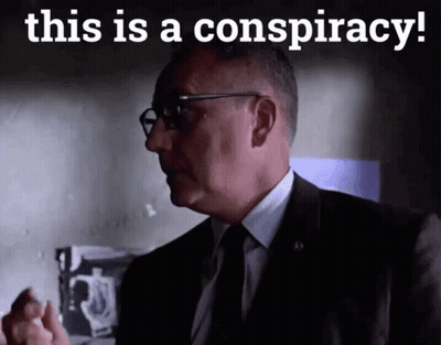 A Man In A Suit And Tie With The Words This Is A Conspiracy Below Him GIF