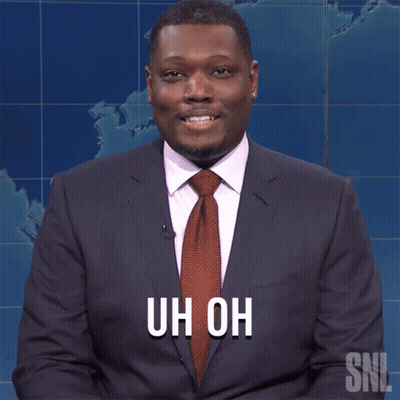 A Man In A Suit And Tie With The Words Uh Oh On His Chest GIF