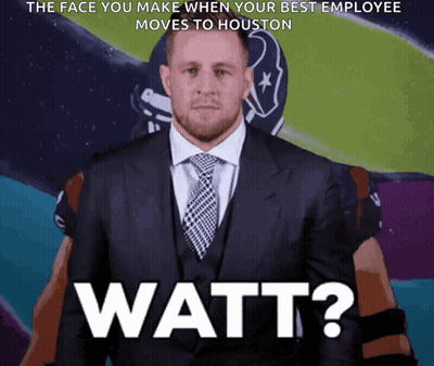 A Man In A Suit And Tie With The Words Watt On The Bottom Right GIF