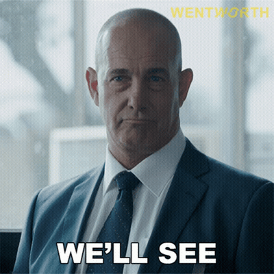 A Man In A Suit And Tie With The Words We 'Ll See Below Him GIF